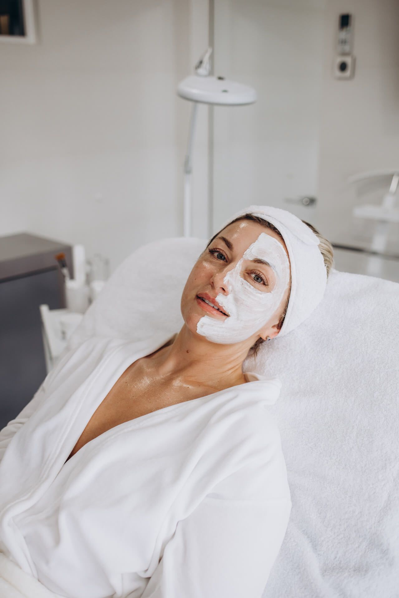 Relaxing facial mask treatment at Lalwa Aesthetics, client enjoying rejuvenating skincare in a calm clinic setting.
