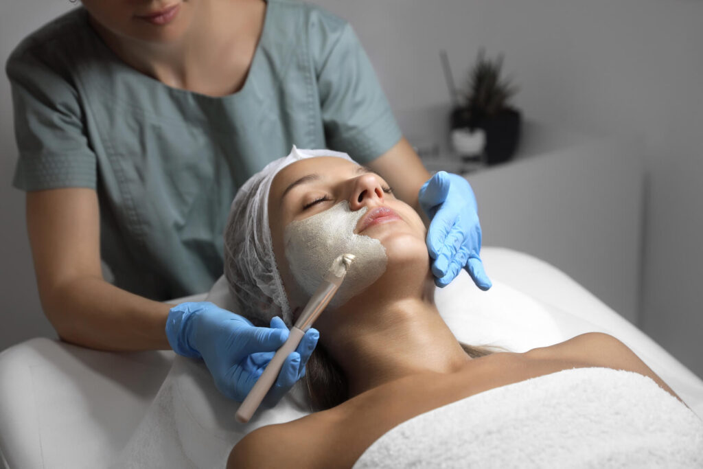 Facial mask application by aesthetic therapist at Lalwa Aesthetics clinic